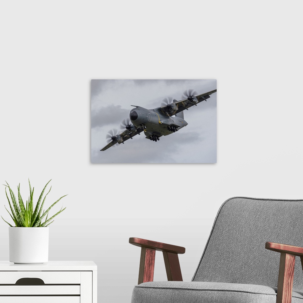 A modern room featuring An A400M Atlas turns on to final approach at RAF Fairford in the United Kingdom.