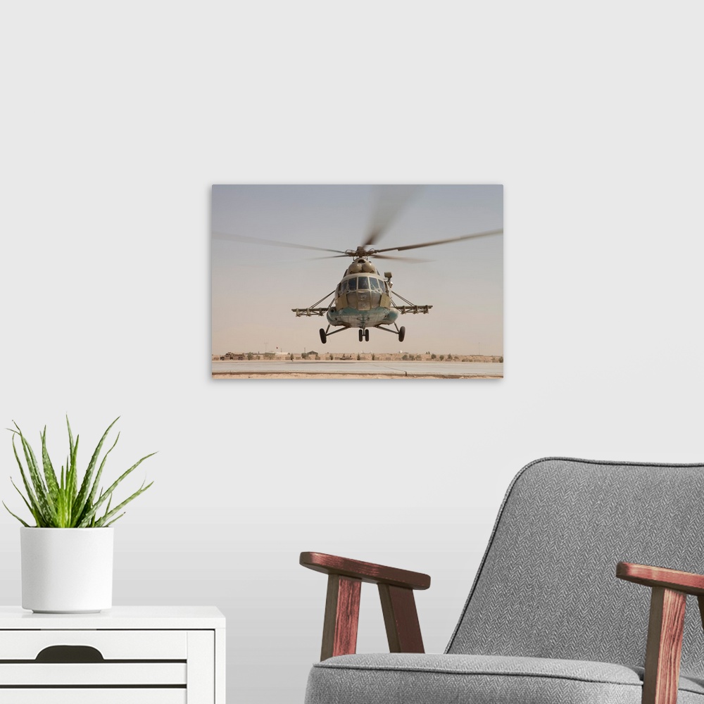 A modern room featuring An Afghan Air Force Russian Mil MI-17 helicopter takes off from Camp Shorabak, Afghanistan.