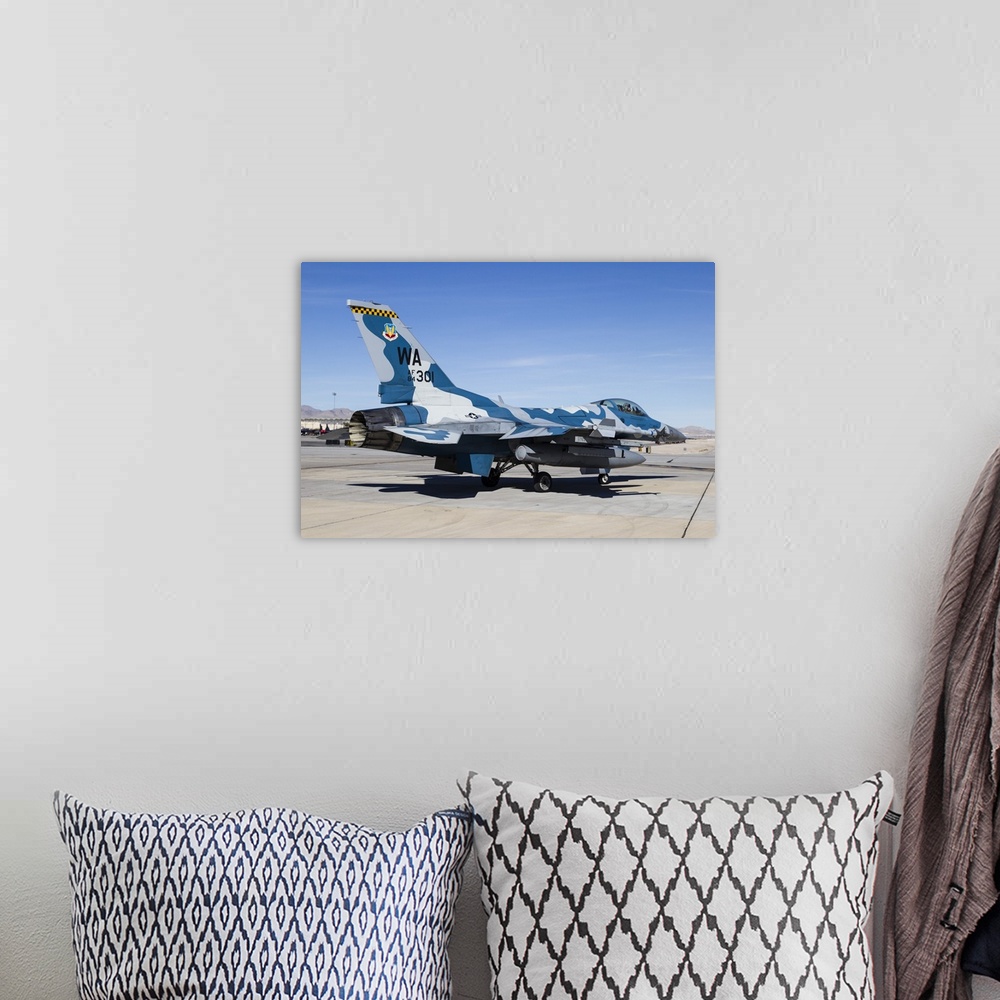 A bohemian room featuring An aggressor F-16 Fighting Falcon of the U.S. Air Force at Nellis Air Force Base.