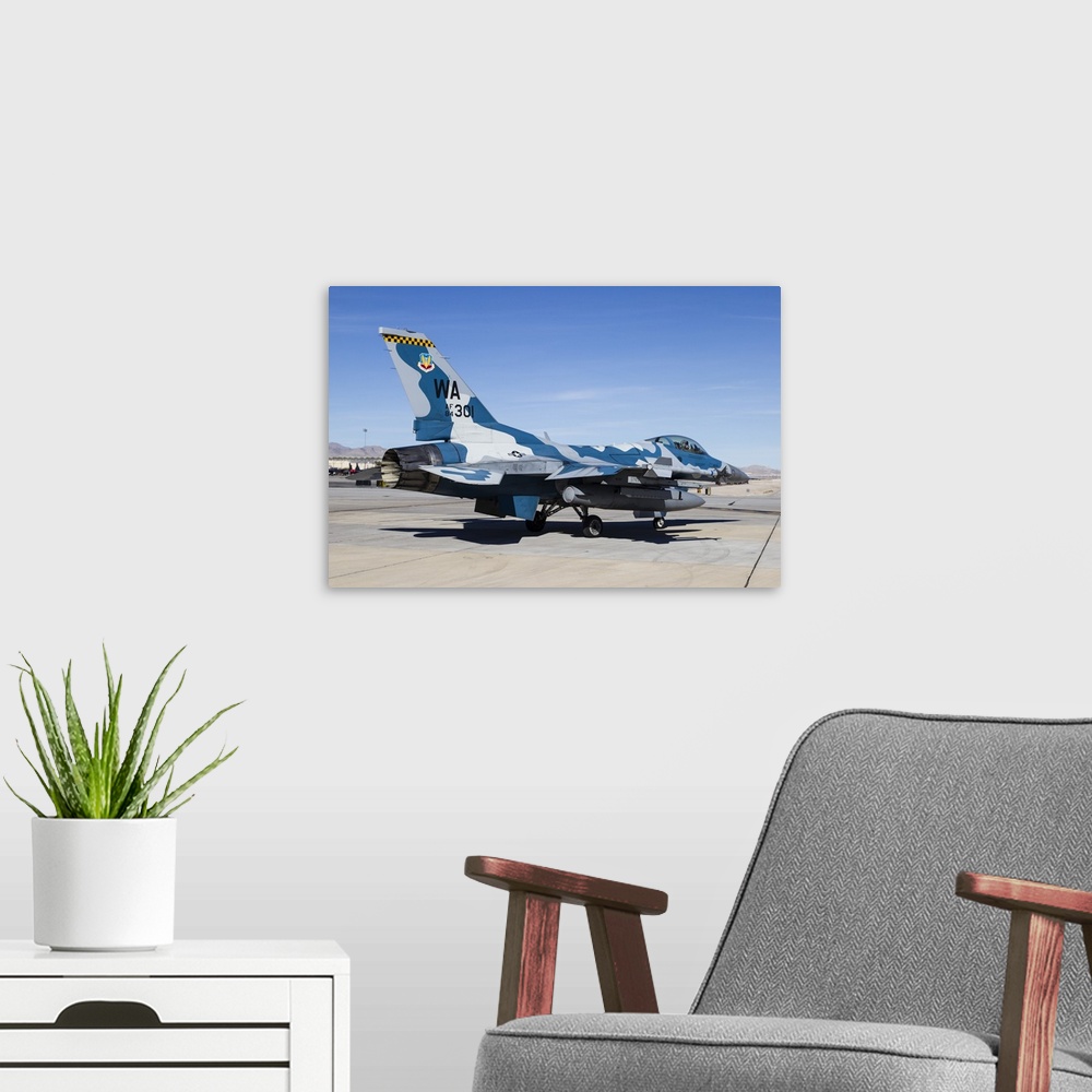 A modern room featuring An aggressor F-16 Fighting Falcon of the U.S. Air Force at Nellis Air Force Base.