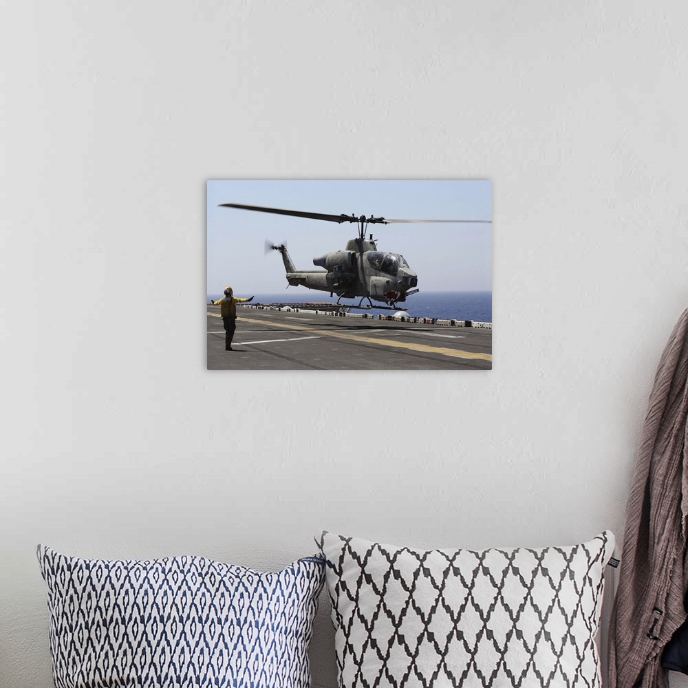 A bohemian room featuring Red Sea, July 23, 2013 - An AH-1W Super Cobra helicopter takes off from the flight deck of the am...