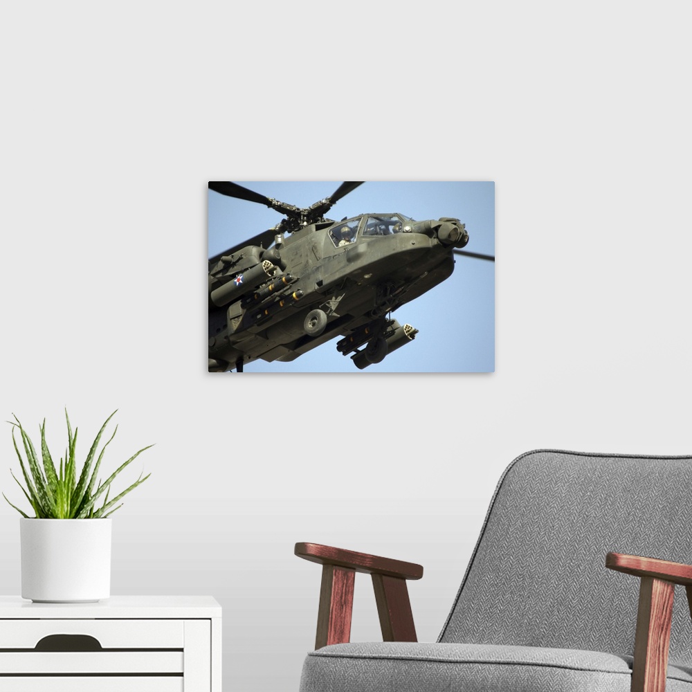 A modern room featuring An AH64 Apache in flight over the Baghdad Hotel in central Baghdad Iraq