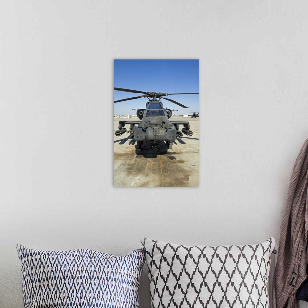 A bohemian room featuring An AH64D Apache Longbow Block III attack helicopter sits on the flight line