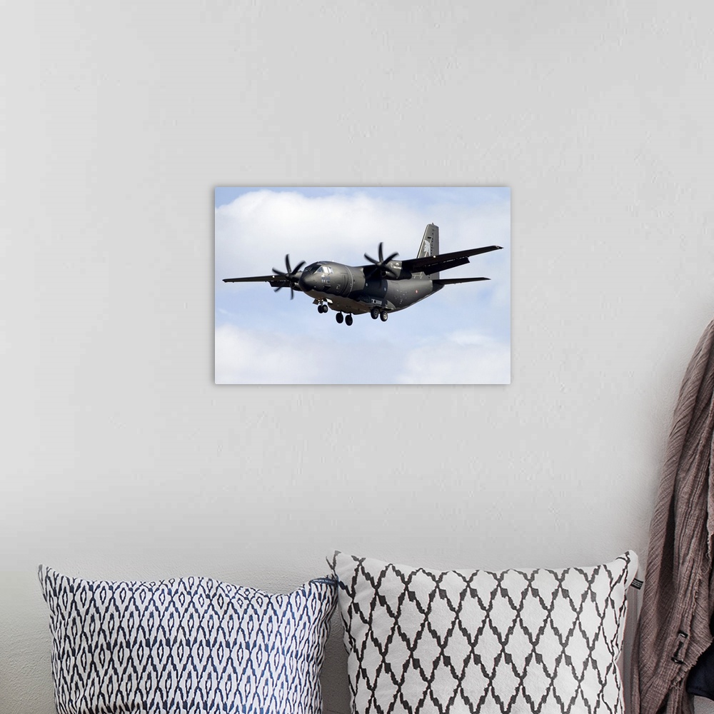 A bohemian room featuring An Alenia C-27J Spartan of the Italian Air Force in flight over Italy.