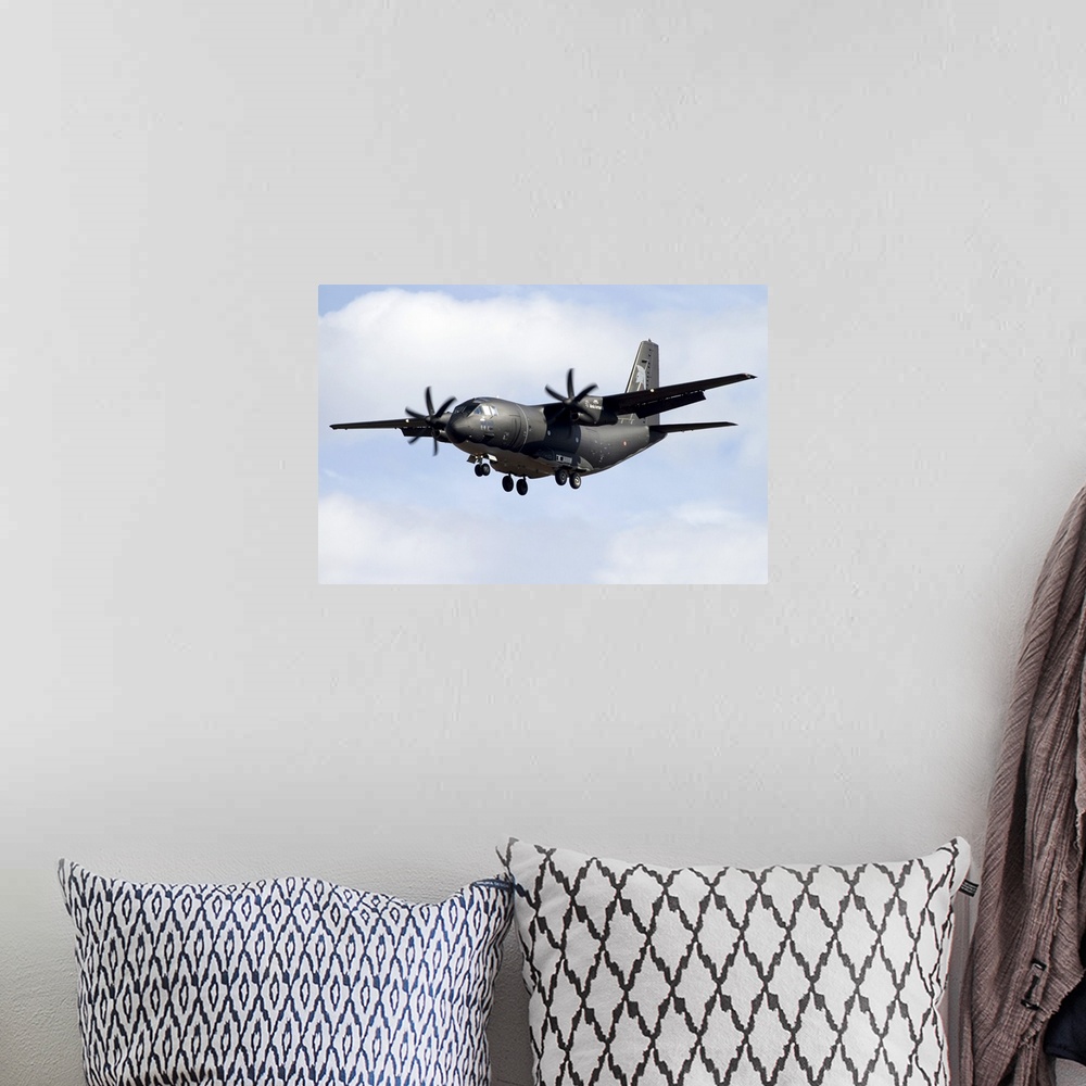 A bohemian room featuring An Alenia C-27J Spartan of the Italian Air Force in flight over Italy.