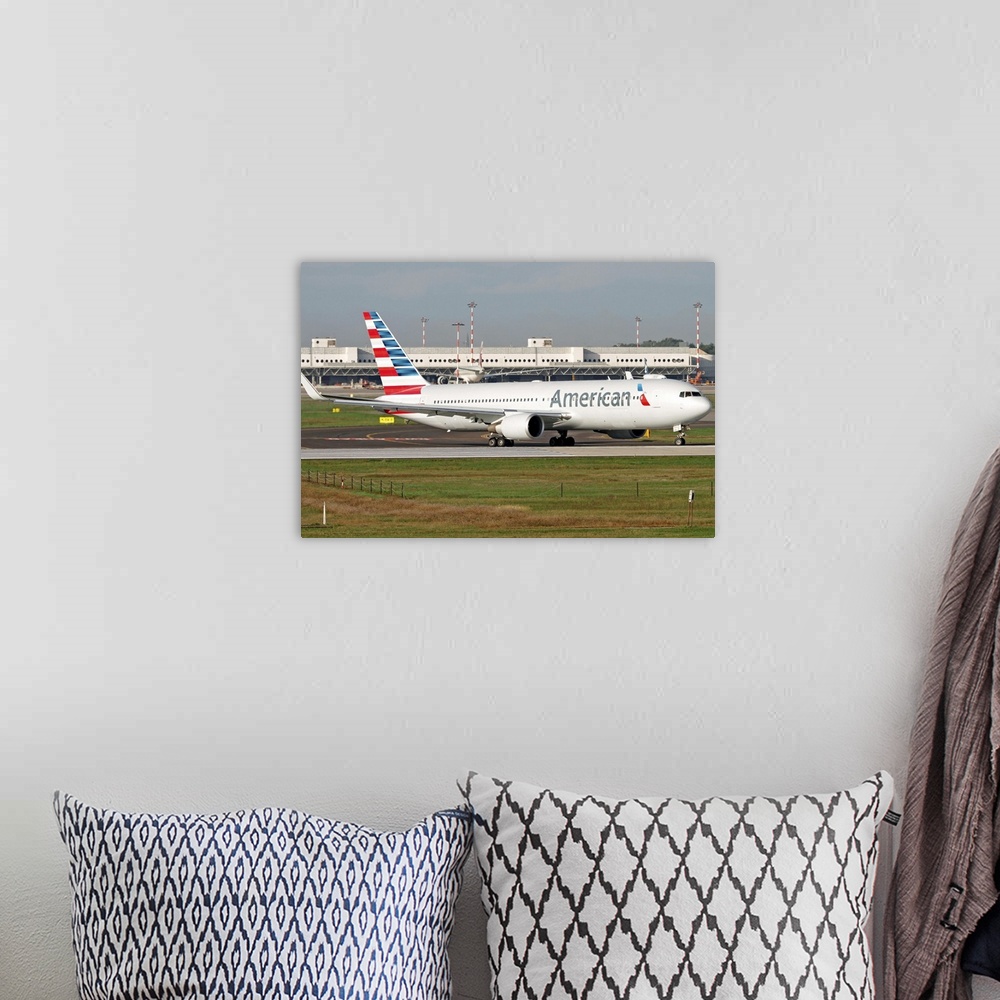 A bohemian room featuring An American Airlines Boeing 767 at Milano Malpensa Airport, Italy.