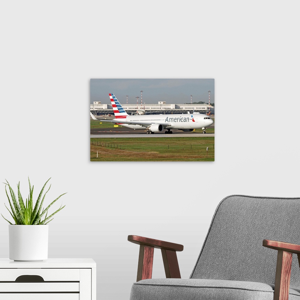 A modern room featuring An American Airlines Boeing 767 at Milano Malpensa Airport, Italy.