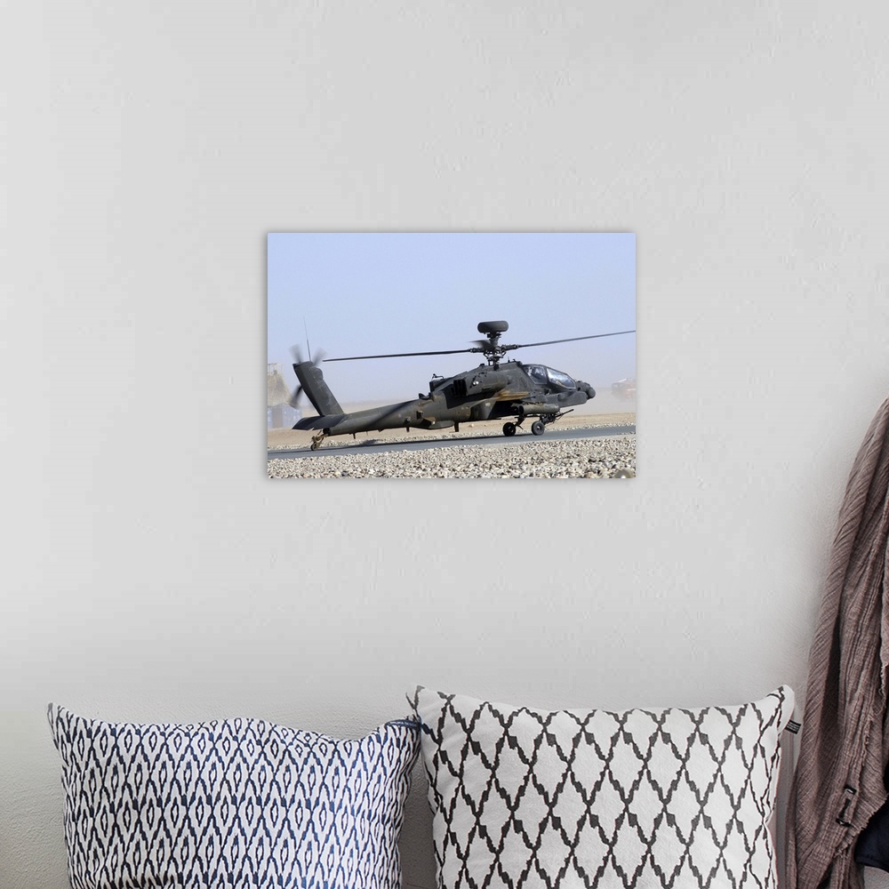 A bohemian room featuring An Apache helicopter prepares for takeoff at Camp Bastion, Afghanistan.