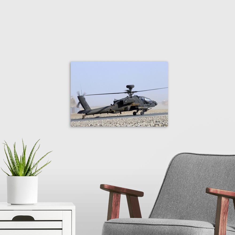 A modern room featuring An Apache helicopter prepares for takeoff at Camp Bastion, Afghanistan.