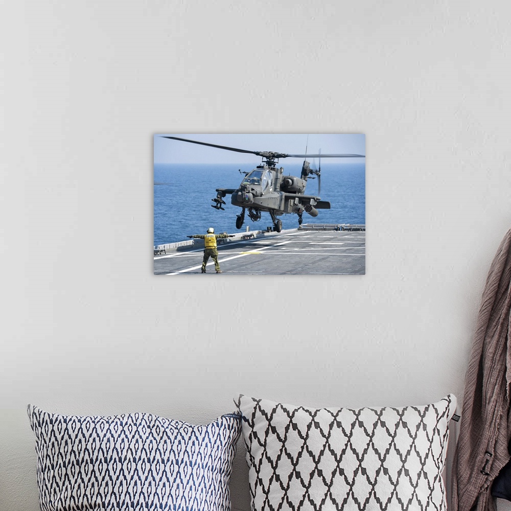 A bohemian room featuring November 11, 2012 - An Army AH-64D Apache helicopter prepares to land aboard the Afloat Forward S...
