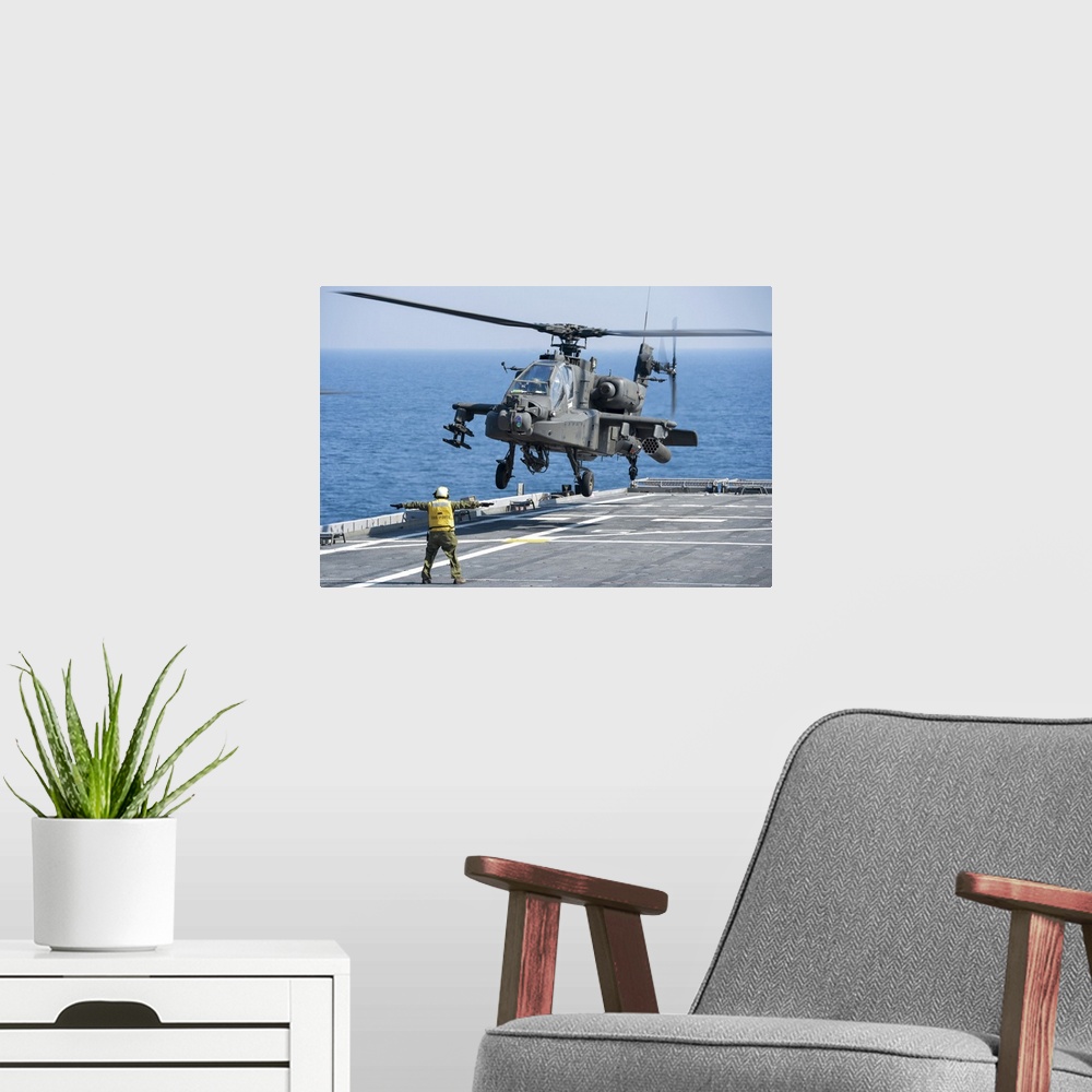 A modern room featuring November 11, 2012 - An Army AH-64D Apache helicopter prepares to land aboard the Afloat Forward S...
