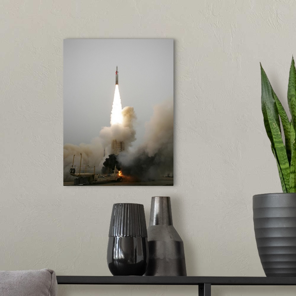A modern room featuring An Arrow anti-ballistic missile interceptor is launched from its mobile platform