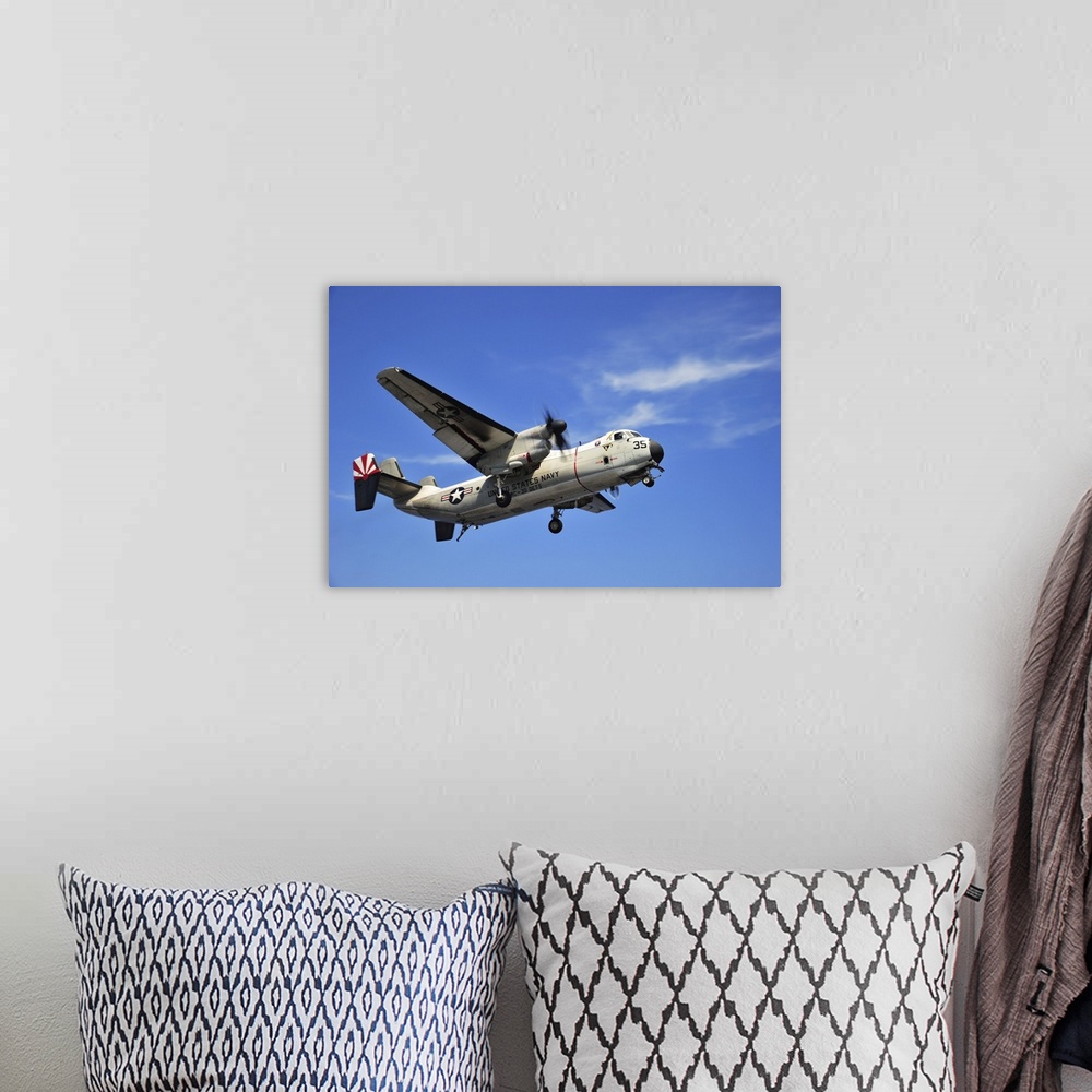 A bohemian room featuring An E-2C Greyhound flying over the South China Sea.
