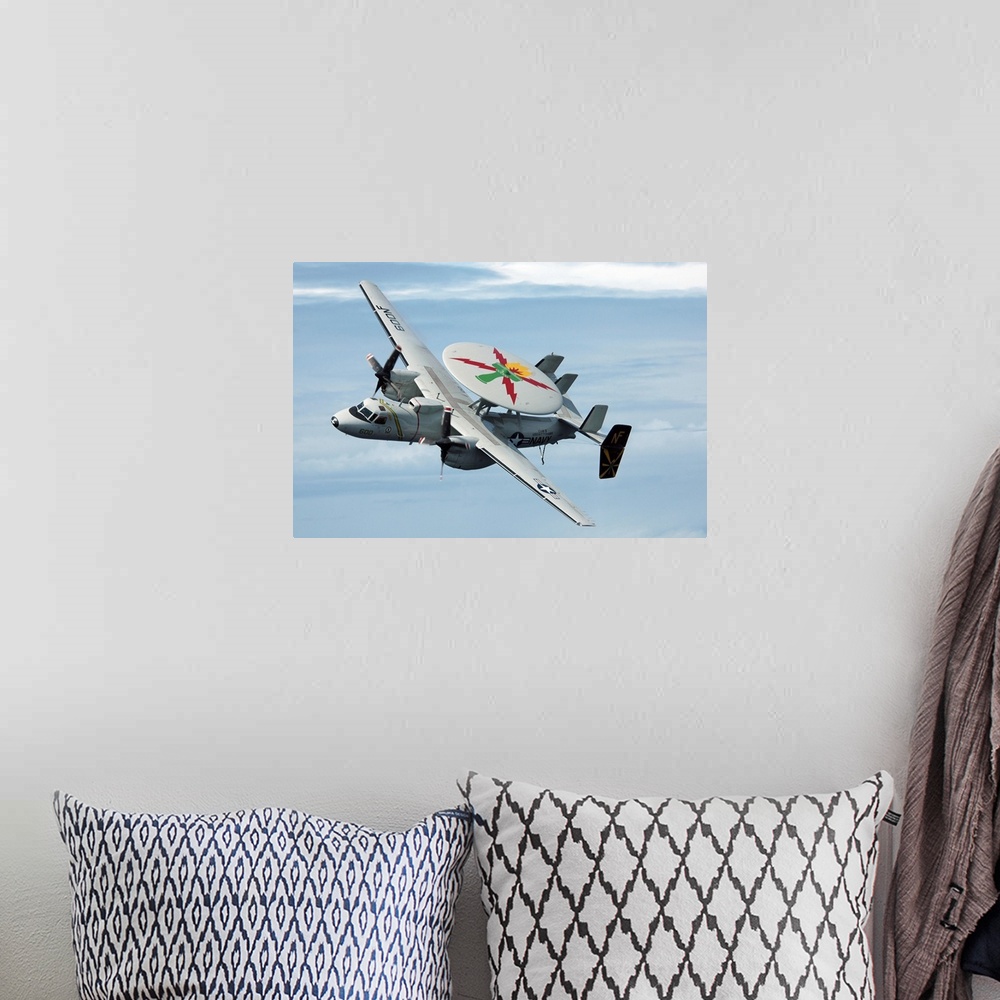 A bohemian room featuring An E-2C Hawkeye in flight.