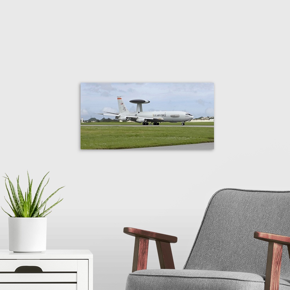 A modern room featuring An E-3 AWACS from the 18th Wing comes into land at Kadena Air Base, Okinawa, Japan.
