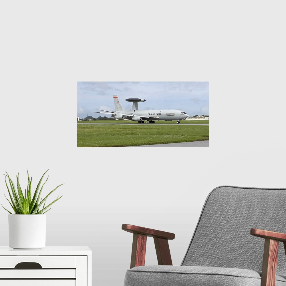 A modern room featuring An E-3 AWACS from the 18th Wing comes into land at Kadena Air Base, Okinawa, Japan.