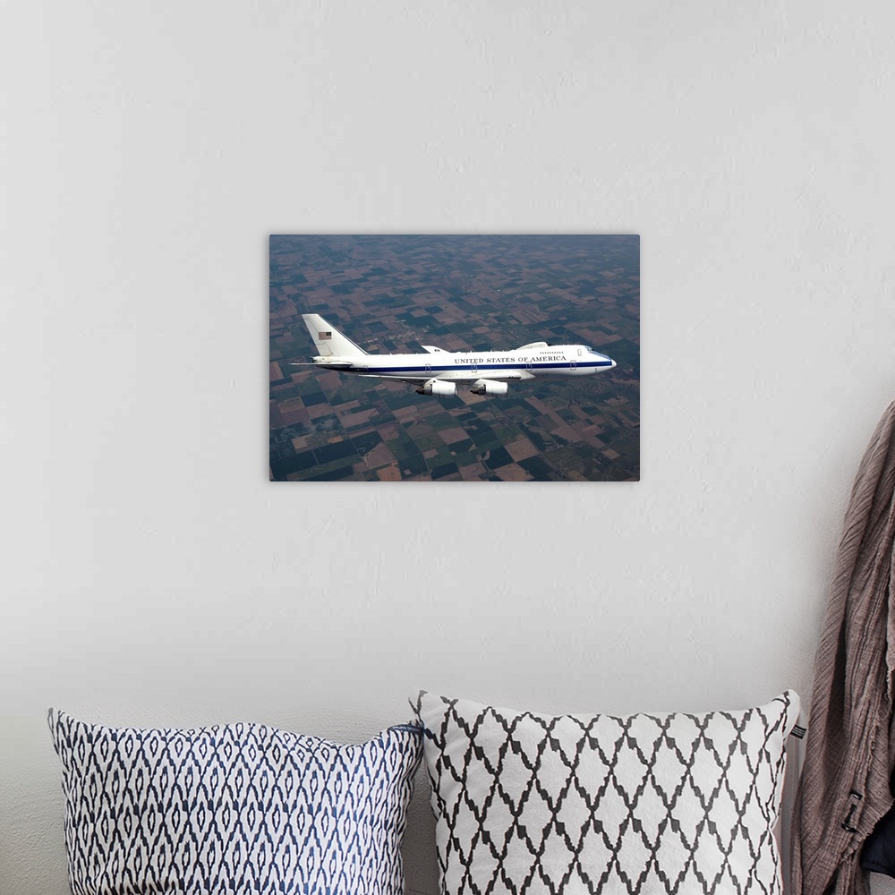 A bohemian room featuring An E-4B National Airborne Operations Center (NAOC) aircraft flies high over the Midwest on a trai...