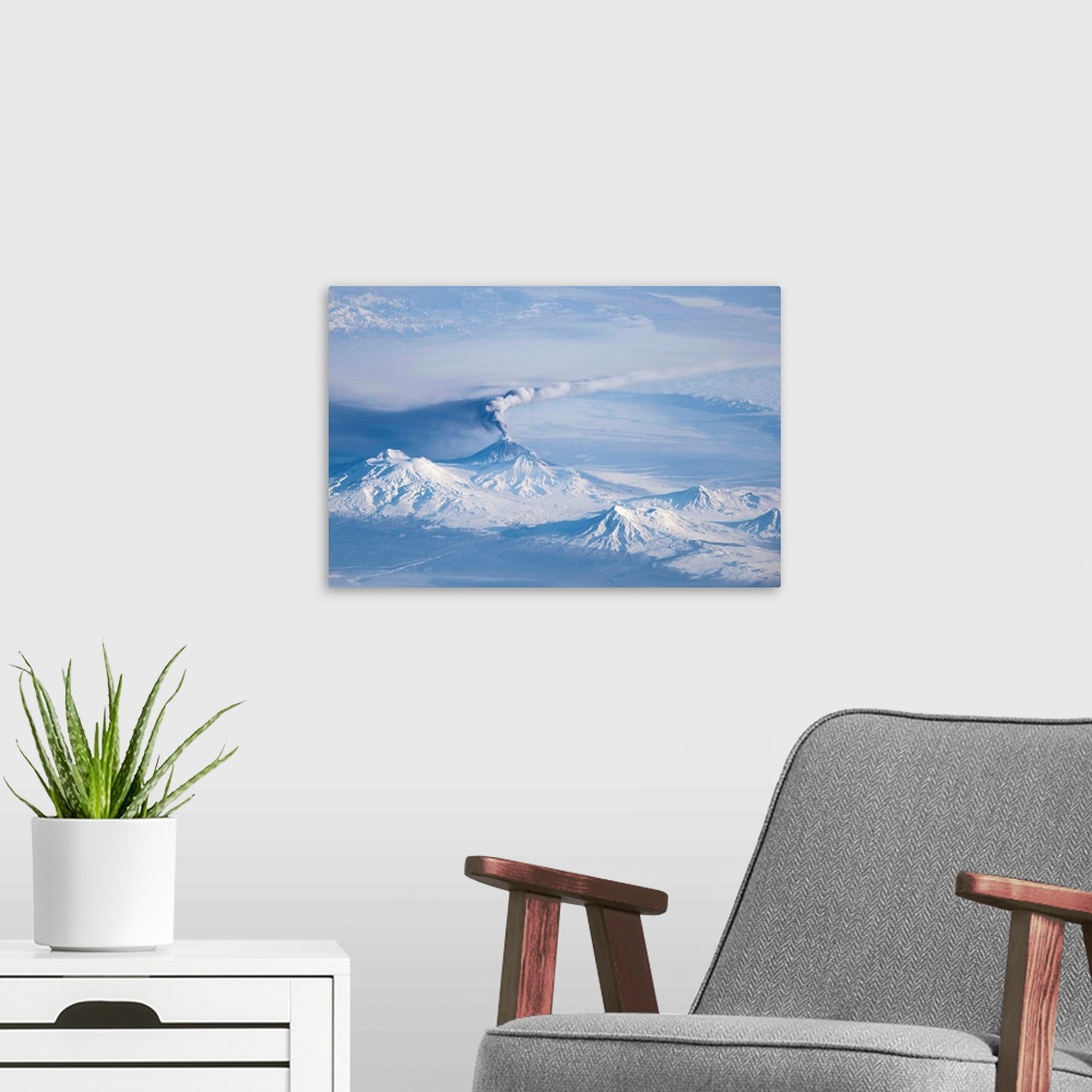 A modern room featuring An eruption plume emanating from Kliuchevskoi, one of the many active volcanoes on the Kamchatka ...
