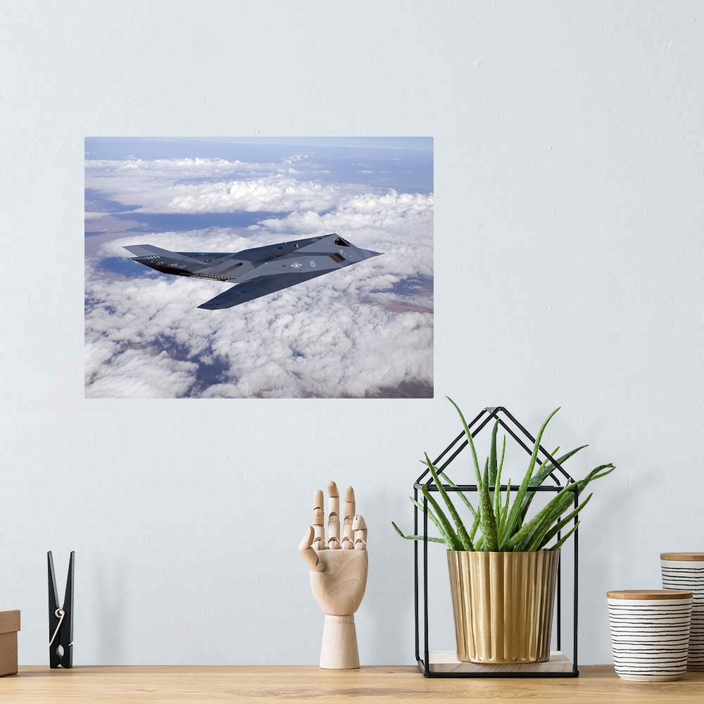 A bohemian room featuring An F-117 Nighthawk from the 53d Test and Evaluation Group's Detachment 1 flies a training sortie ...