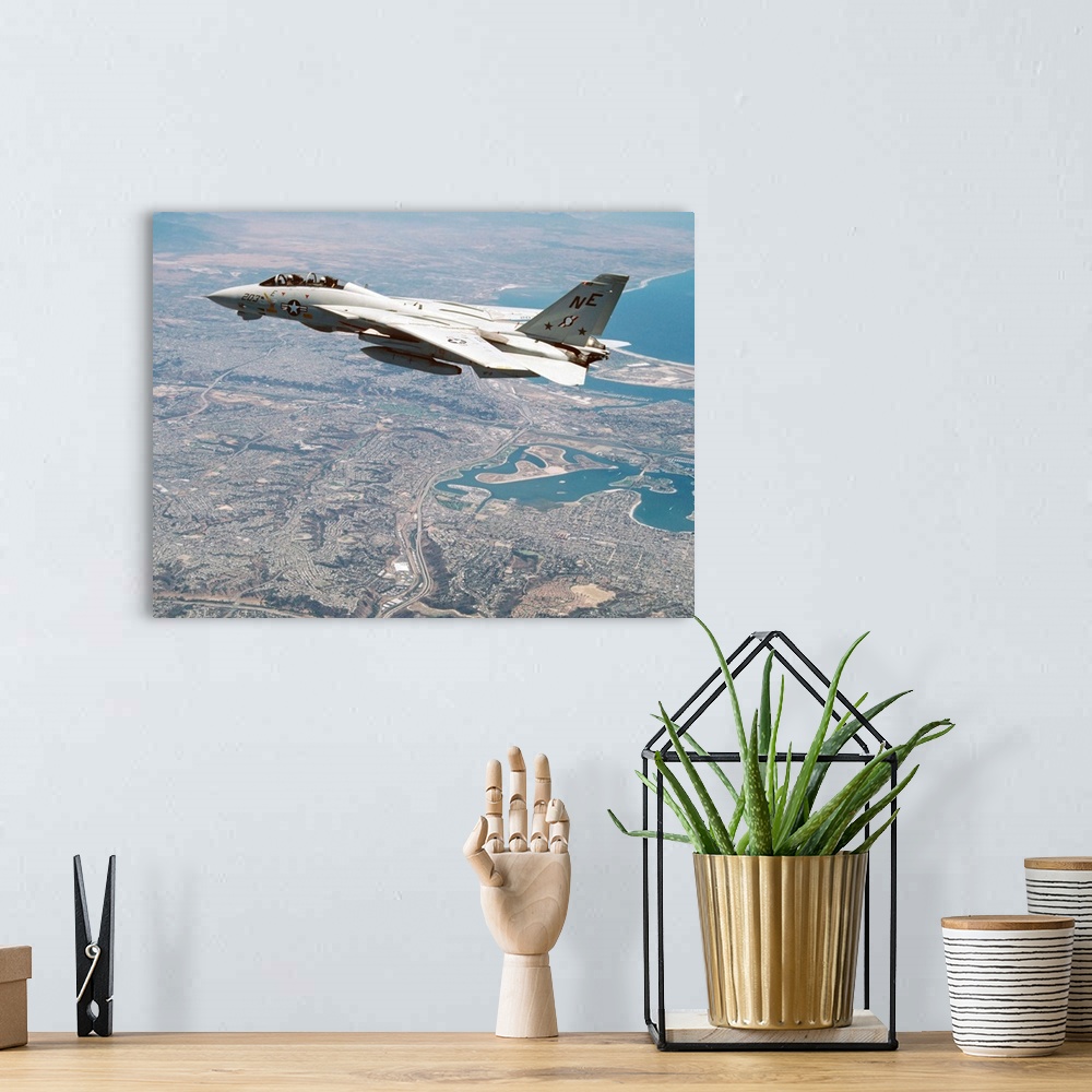 A bohemian room featuring An F-14A Tomcat of U.S. Navy Fighter Squadron 2 (VF-2, the Bounty Hunters) cruises above San Dieg...
