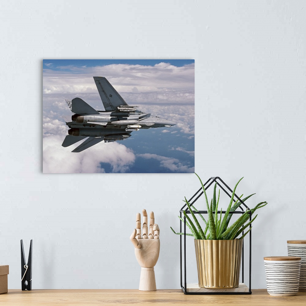 A bohemian room featuring An F-14A Tomcat of U.S. Navy Fighter Squadron 211, the Fighting Checkmates (VF-211), returning fo...