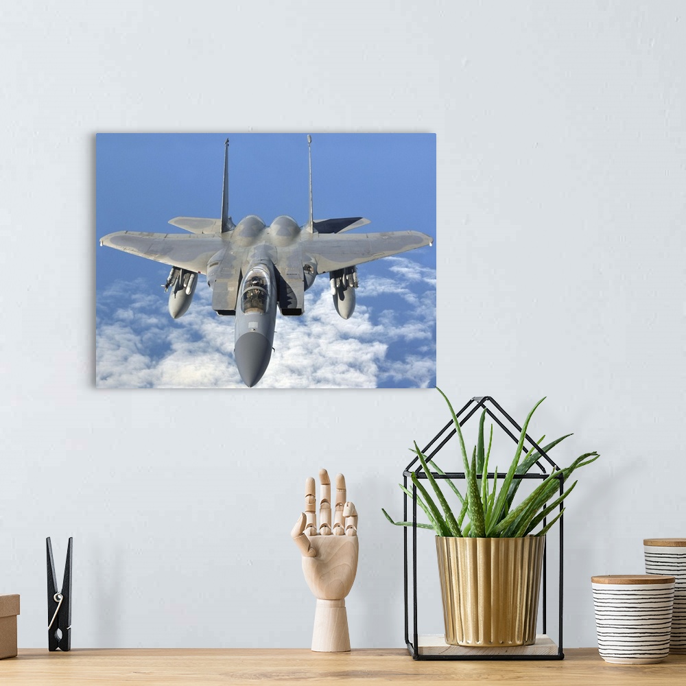 A bohemian room featuring September 12, 2013 - An F-15C Eagle prepares to refuel with a KC-135R Stratotanker en route to th...