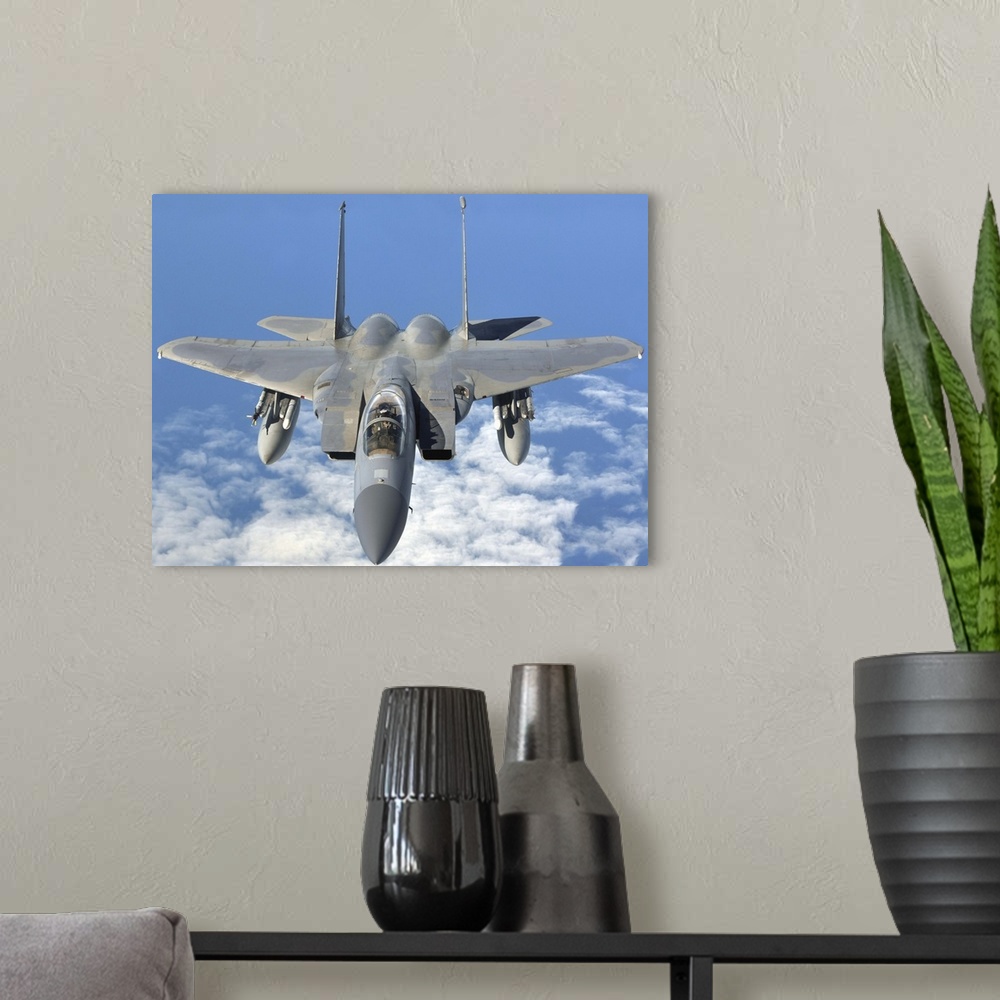 A modern room featuring September 12, 2013 - An F-15C Eagle prepares to refuel with a KC-135R Stratotanker en route to th...
