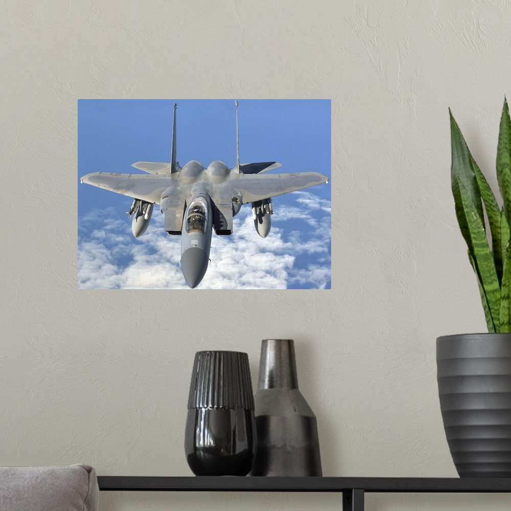 A modern room featuring September 12, 2013 - An F-15C Eagle prepares to refuel with a KC-135R Stratotanker en route to th...