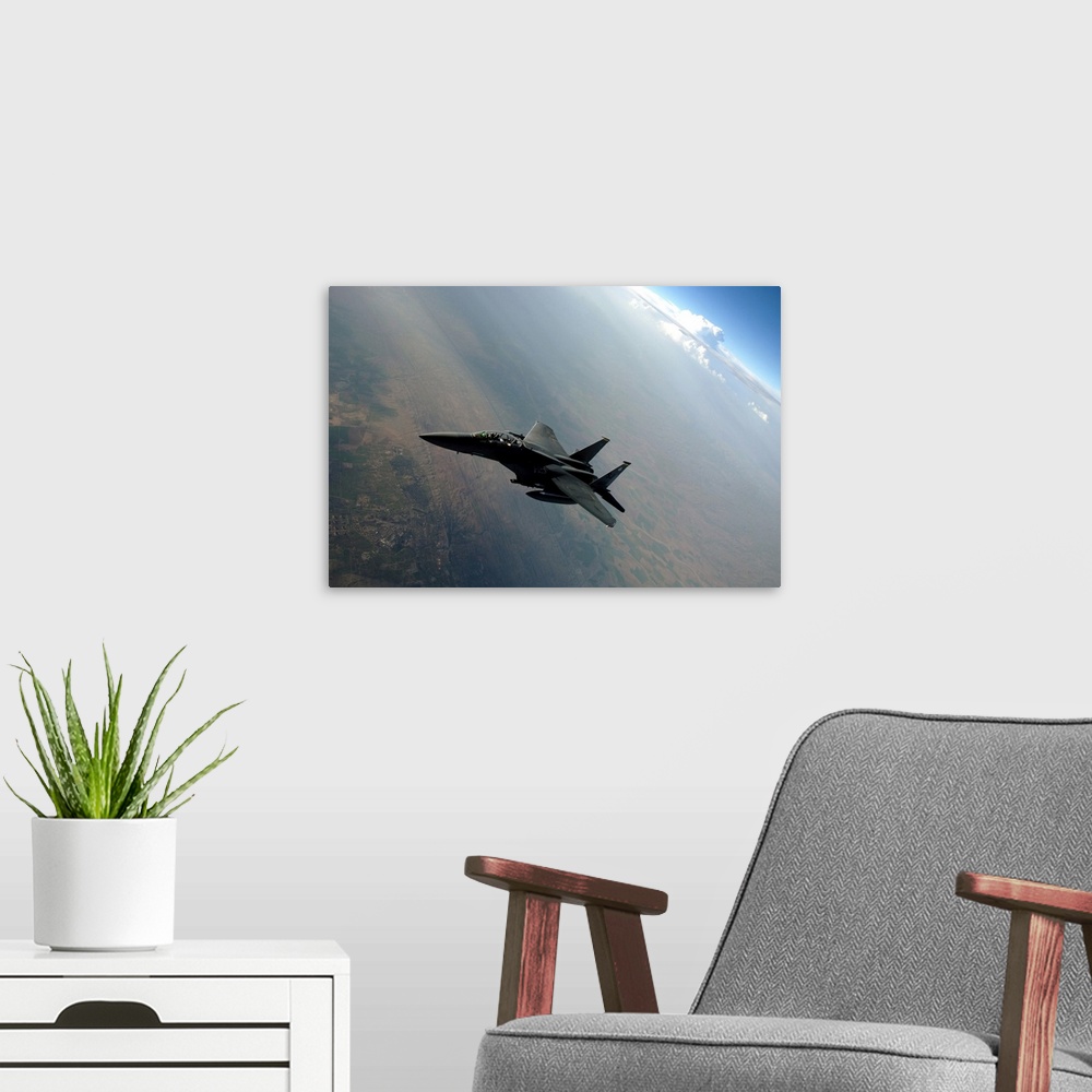A modern room featuring An F-15E Strike Eagle breaks away from a KC-135 Stratotanker after refueling.