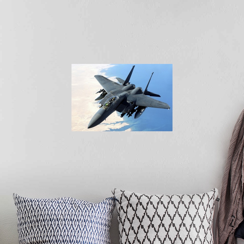 A bohemian room featuring An F-15E Strike Eagle flies over Iraq during a combat mission.