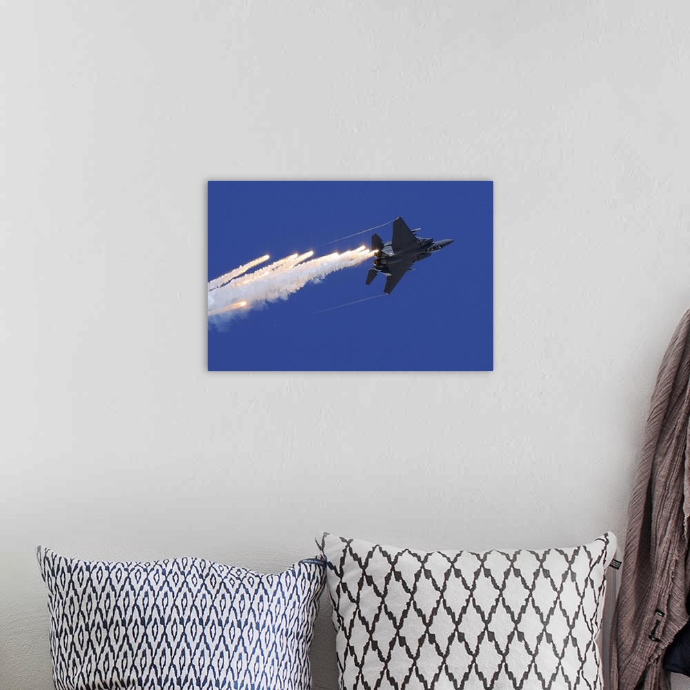 A bohemian room featuring November 11, 2012 - An F-15E Strike Eagle releases flares above Nellis Air Force Base, Nevada.