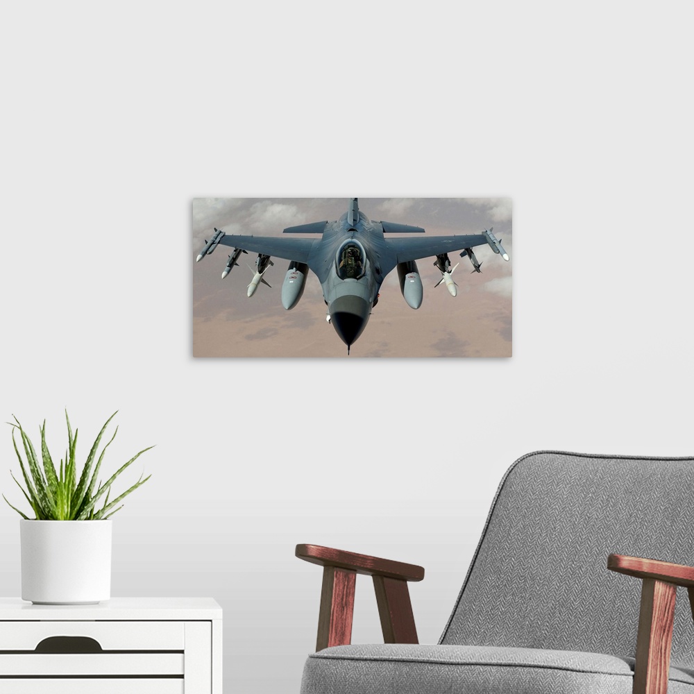 A modern room featuring An F-16 Fighting Falcon flies a mission in the skies near Iraq.