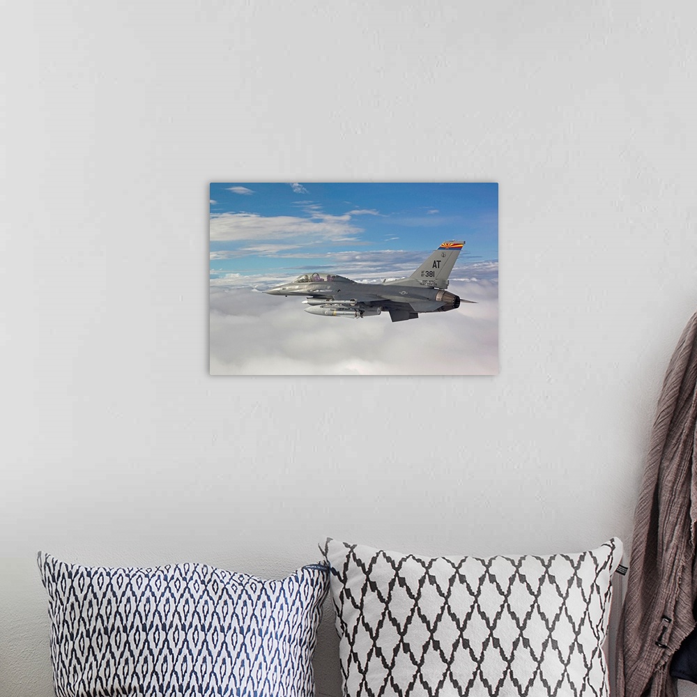 A bohemian room featuring An F-16 Fighting Falcon from the Air National Guard Air Force Reserve Test Center flies with an A...
