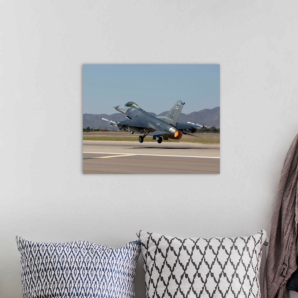 A bohemian room featuring A 56th Fighter Wing F-16 Fighting Falcon from Luke Air Force Base, Arizona, takes off on a traini...