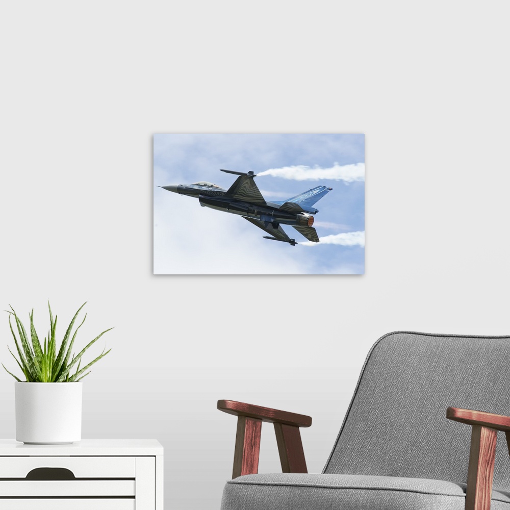 A modern room featuring An F-16A Mide-Life Update of the Belgian Air Force in flight.