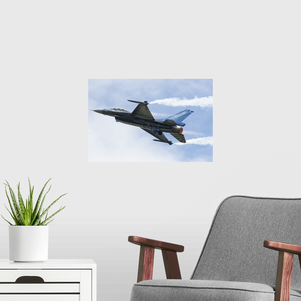 A modern room featuring An F-16A Mide-Life Update of the Belgian Air Force in flight.