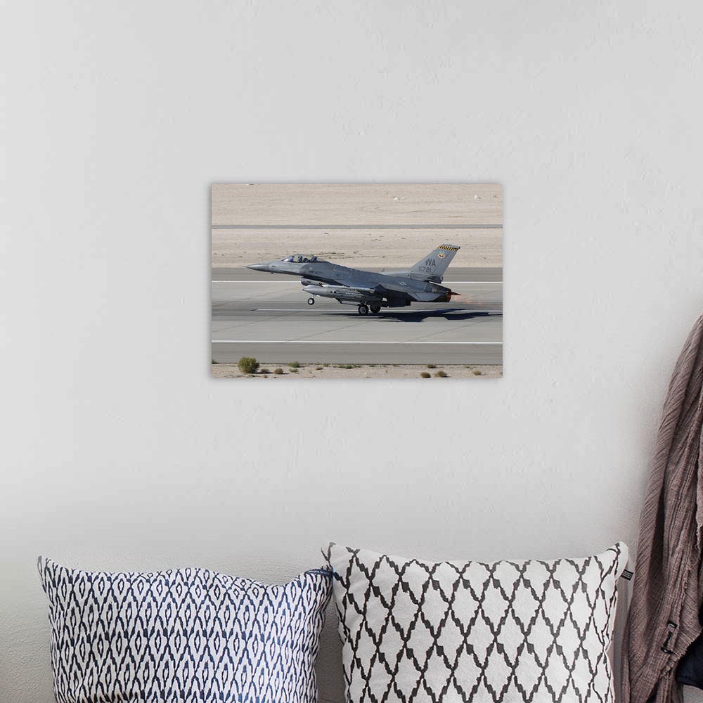 A bohemian room featuring An F-16C Fighting Falcon taking off from Nellis Air Force Base.