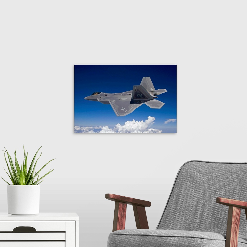 A modern room featuring An F-22 Raptor flies around Southern New Mexico on a training mission out of Holloman Air Force B...