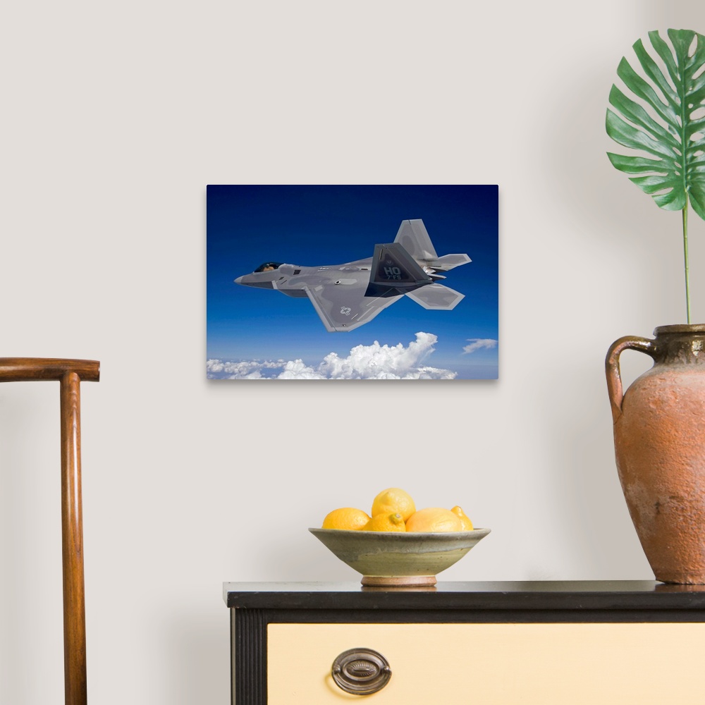 A traditional room featuring An F-22 Raptor flies around Southern New Mexico on a training mission out of Holloman Air Force B...