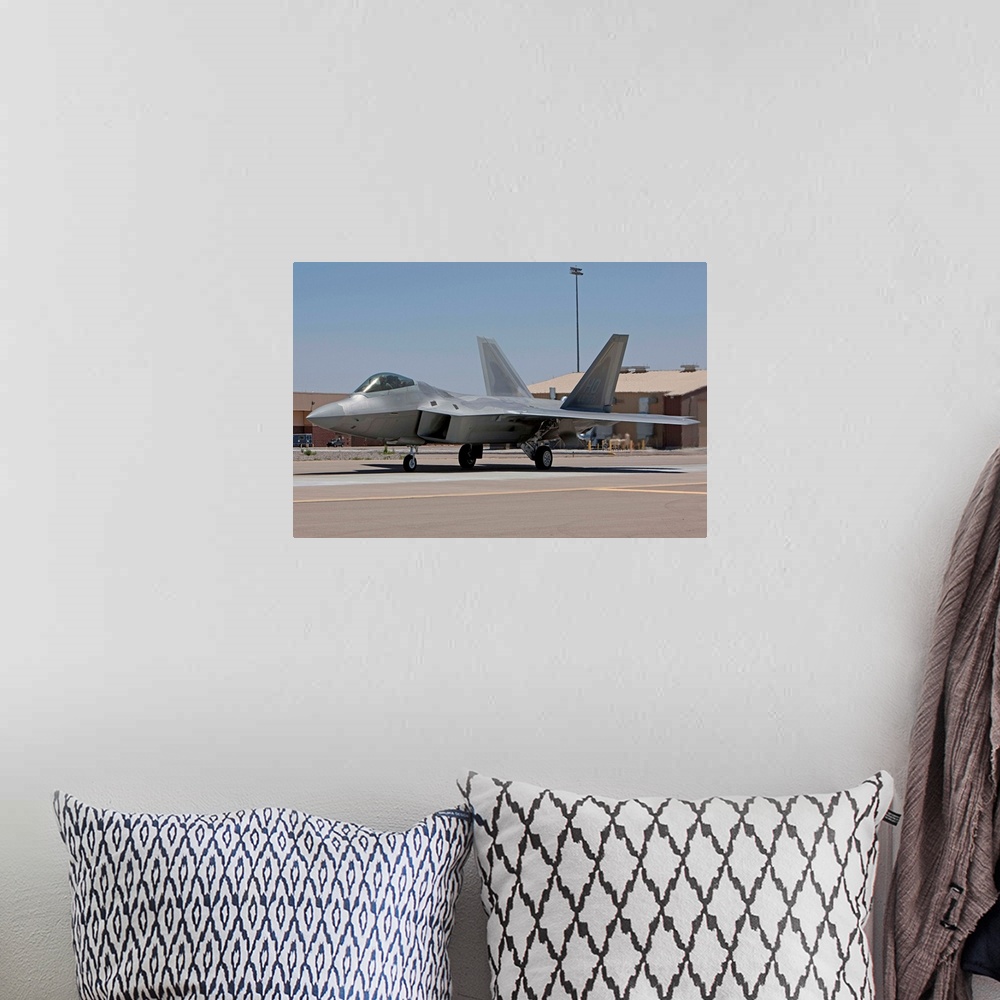 A bohemian room featuring An F-22 Raptor taxi's to the runway for a training mission out of Holloman Air Force Base, New Me...