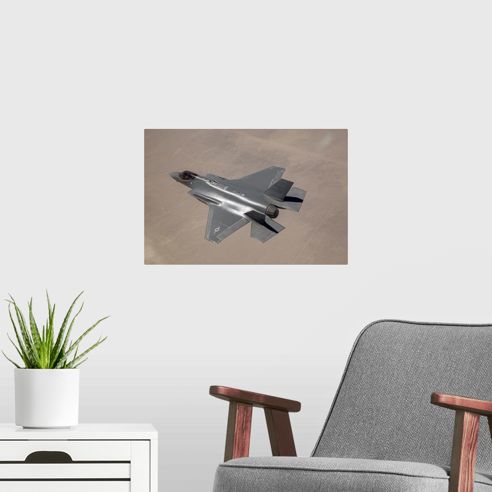 A modern room featuring June 11, 2014 - An AF-2, the second production F-35 Lightning II of the U.S. Air Force, flies ove...
