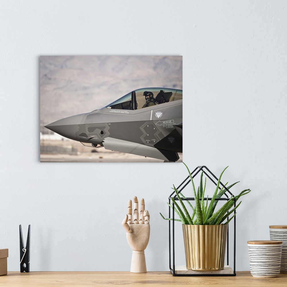 A bohemian room featuring An F-35A Lightning II taxiing at Nellis Air Force Base, Nevada.