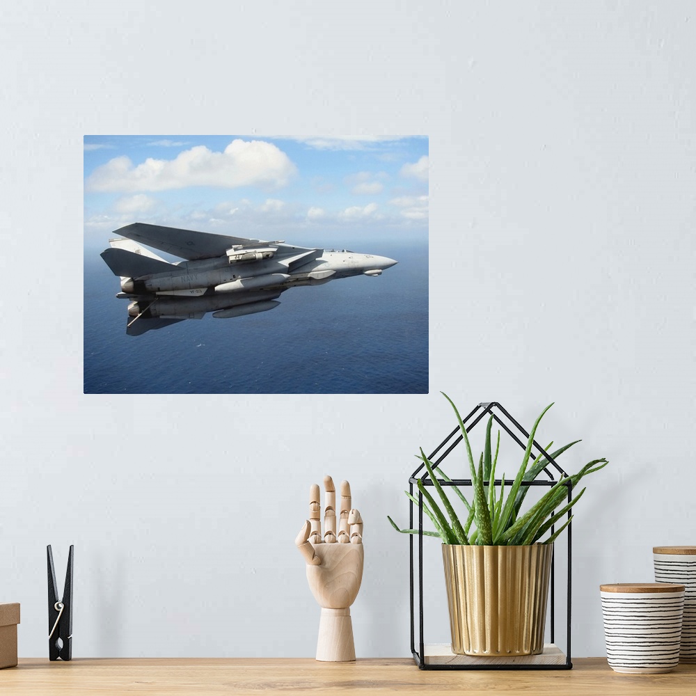 A bohemian room featuring An F14D Tomcat banks with its tailhook lowered in preparation for landing