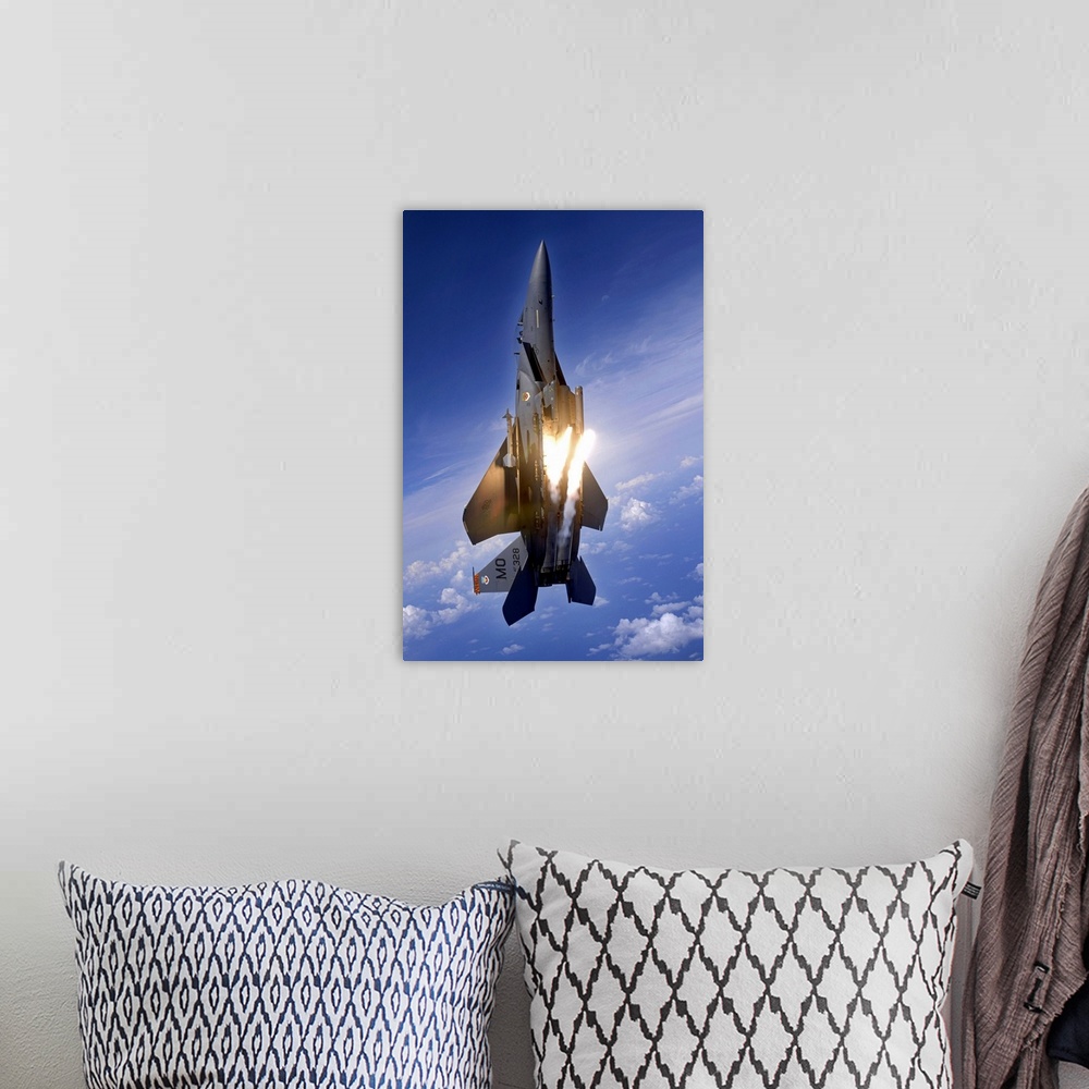 A bohemian room featuring Vertical panoramic of American all-weather multirole fighter launching flares as it travels upwar...