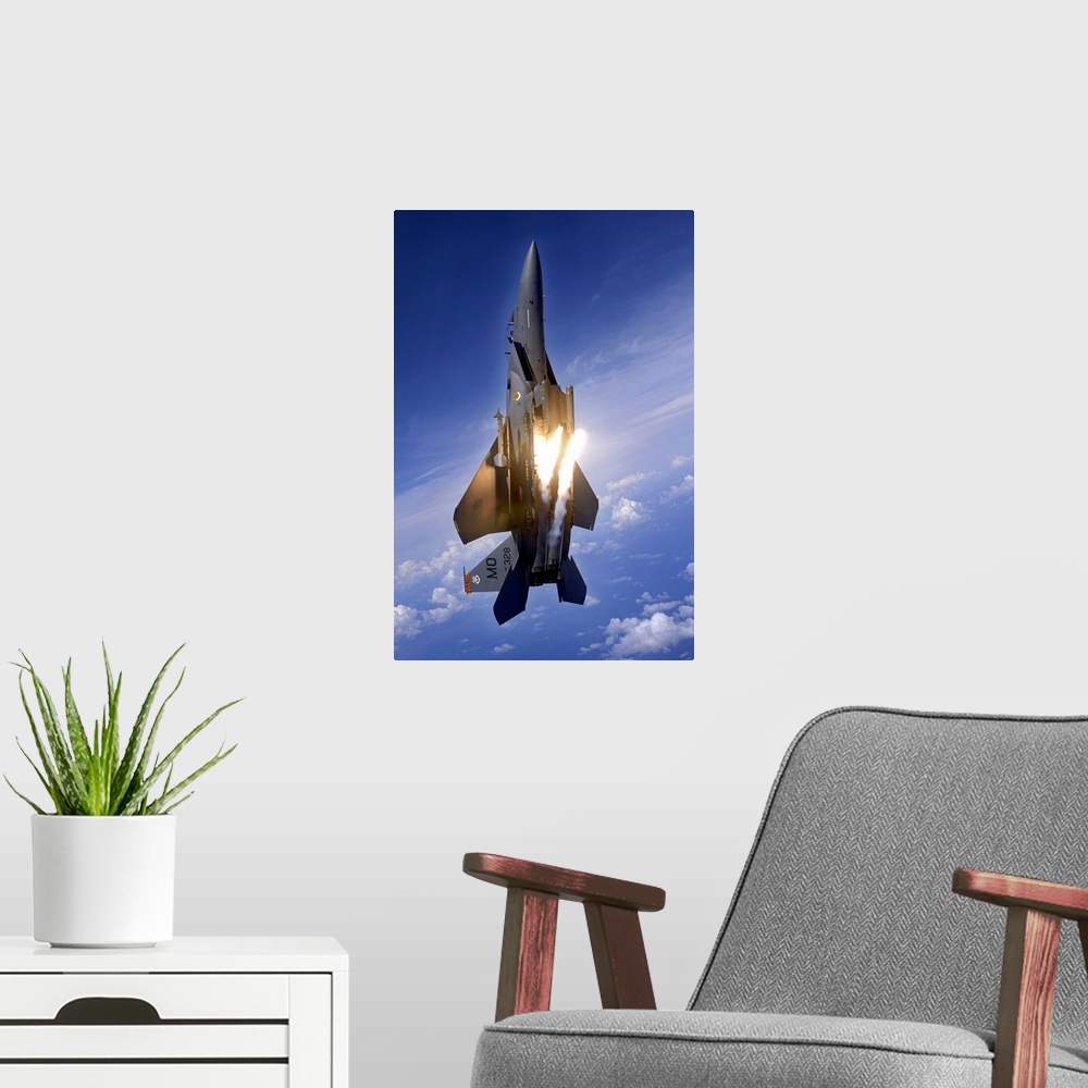 A modern room featuring Vertical panoramic of American all-weather multirole fighter launching flares as it travels upwar...