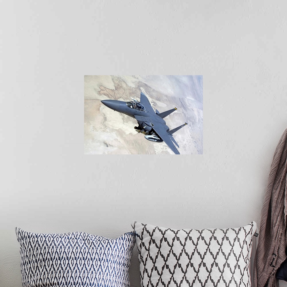 A bohemian room featuring An F15E Strike Eagle turns away after recieving fuel