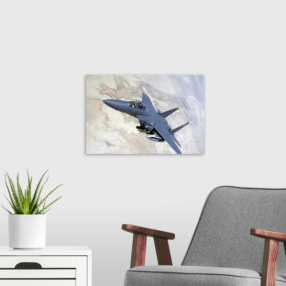 A modern room featuring An F15E Strike Eagle turns away after recieving fuel