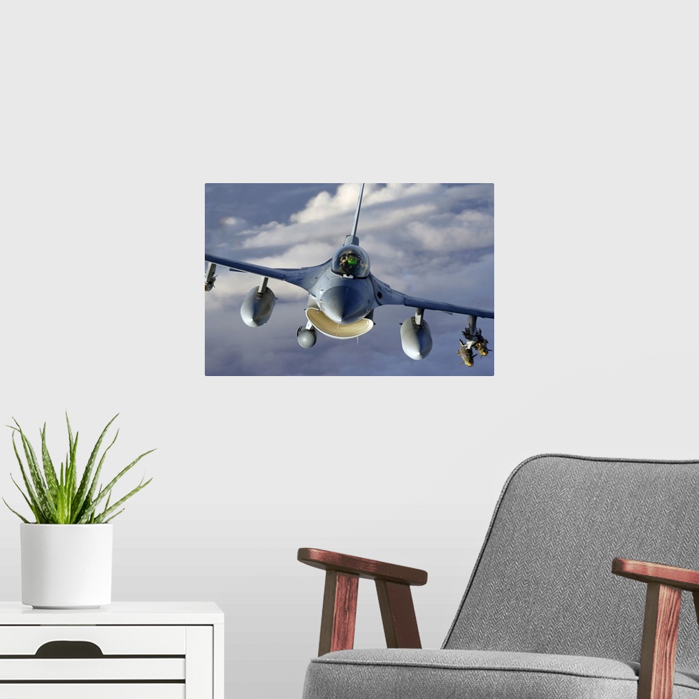 A modern room featuring Canvas photo art of the up close of a jet flying through the skies.