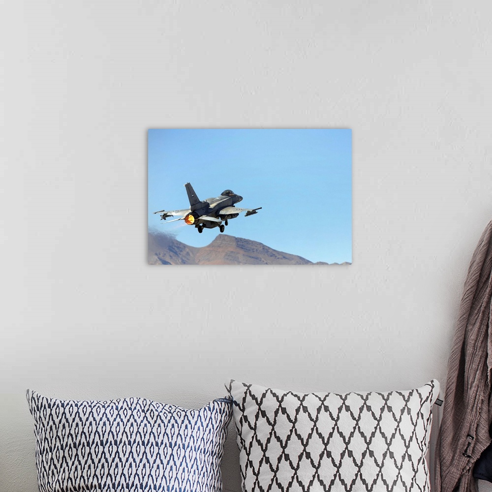 A bohemian room featuring An F16E from the United Arab Emirates taking off at Nellis Air Force Base Nevada