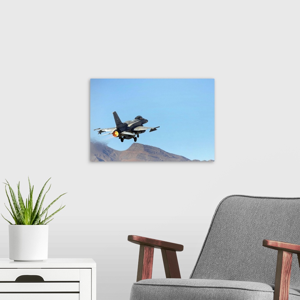 A modern room featuring An F16E from the United Arab Emirates taking off at Nellis Air Force Base Nevada
